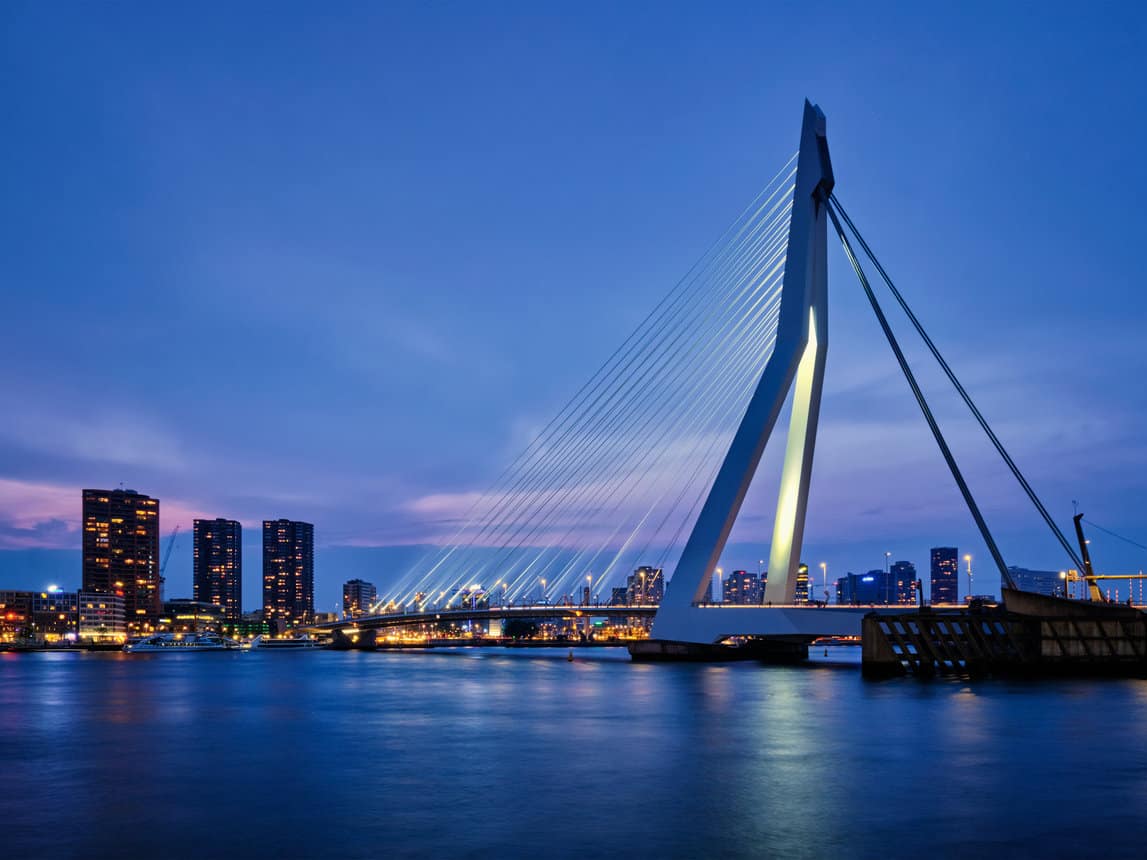 Erasmus Bridge in Rotterdam, showcasing modern architecture against a clear blue sky. Erasmus Bridge in Rotterdam, showcasing modern architecture against a clear blue sky.