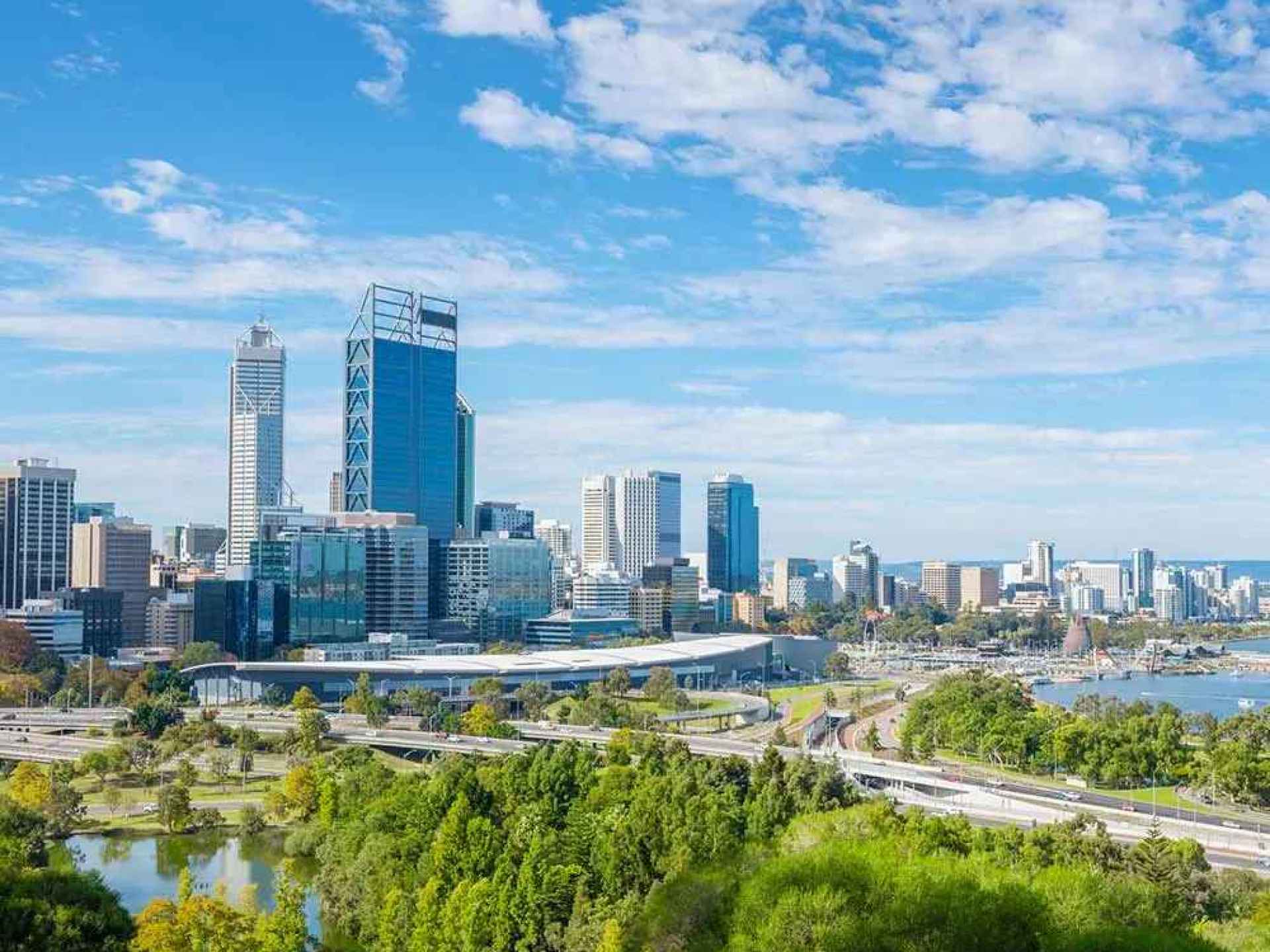 A bustling square in Perth showcasing vibrant urban life with people enjoying the sunny atmosphere and modern architecture. A bustling square in Perth showcasing vibrant urban life with people enjoying the sunny atmosphere and modern architecture.