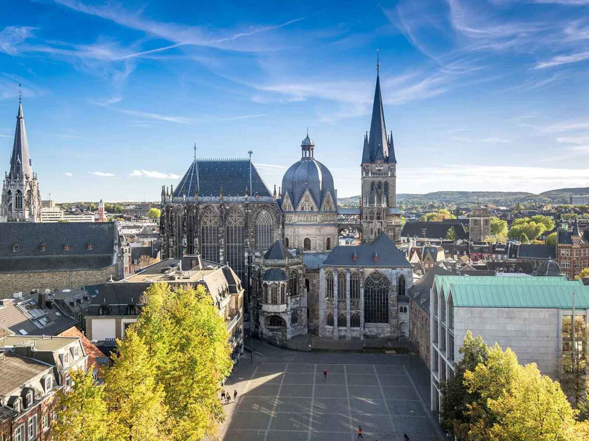Stunning view of Aachen Cathedral, showcasing its remarkable architecture against the backdrop of Aachen, Germany. Stunning view of Aachen Cathedral, showcasing its remarkable architecture against the backdrop of Aachen, Germany.