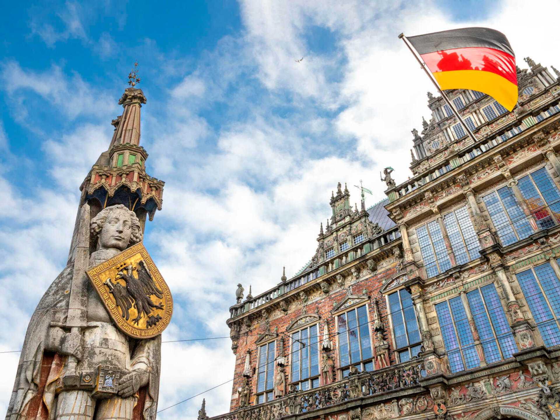 Statue of Roland in front of Bremen City Hall, showcasing the historical architecture and cultural significance of Bremen. Statue of Roland in front of Bremen City Hall, showcasing the historical architecture and cultural significance of Bremen.
