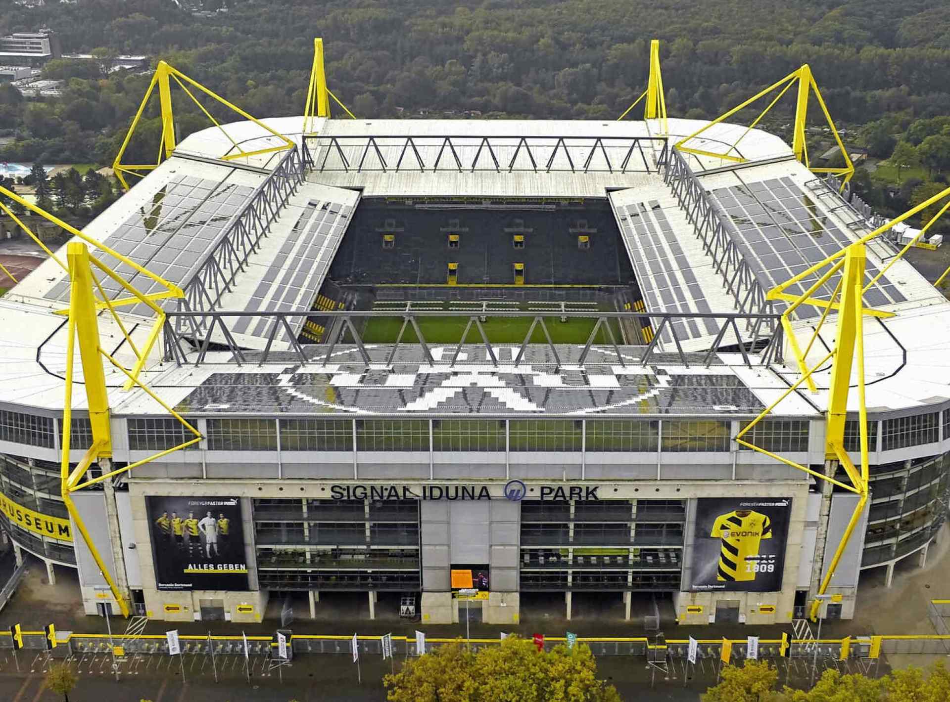 Image of Signal Iduna Park in Dortmund, showcasing the iconic stadium and surrounding architecture on a bright day. Image of Signal Iduna Park in Dortmund, showcasing the iconic stadium and surrounding architecture on a bright day.