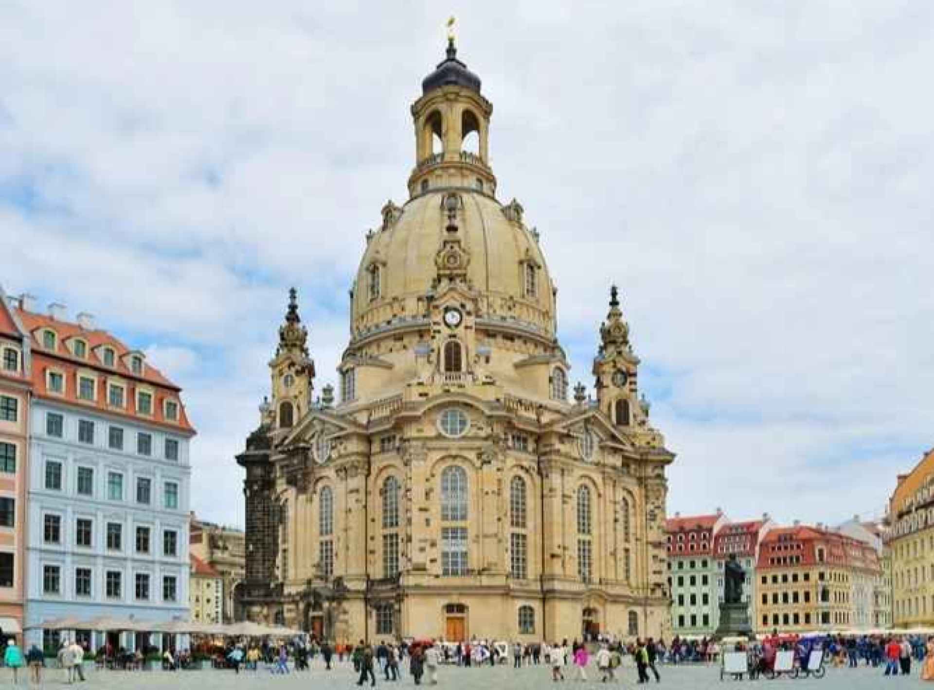 A stunning view of the Frauenkirche in Dresden, showcasing its beautiful architecture against a clear blue sky. A stunning view of the Frauenkirche in Dresden, showcasing its beautiful architecture against a clear blue sky.