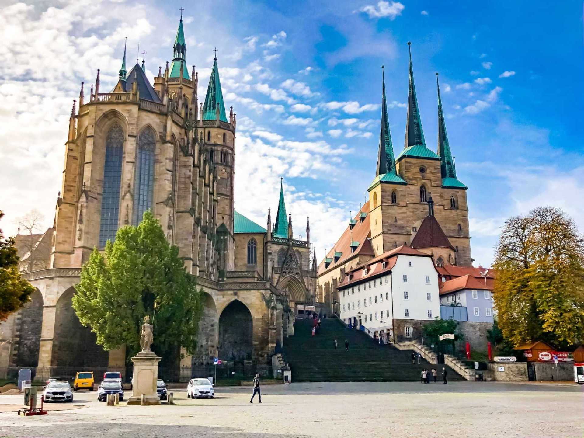 Erfurt Cathedral soaring against a clear sky in Erfurt, showcasing stunning Gothic architecture and historic charm. Erfurt Cathedral soaring against a clear sky in Erfurt, showcasing stunning Gothic architecture and historic charm.