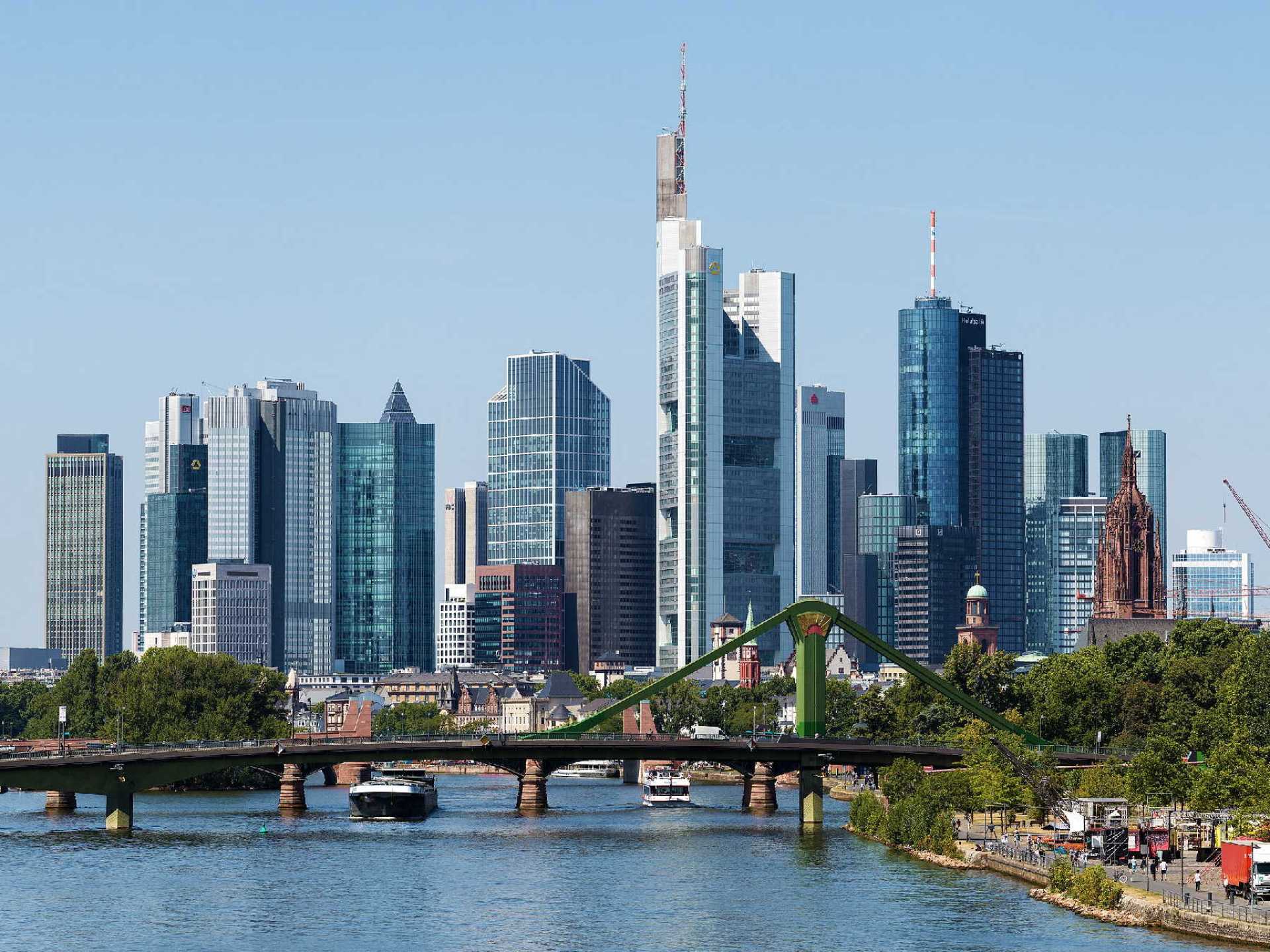 Skyline of Frankfurt am Main showcasing modern architecture against a clear blue sky. Skyline of Frankfurt am Main showcasing modern architecture against a clear blue sky.