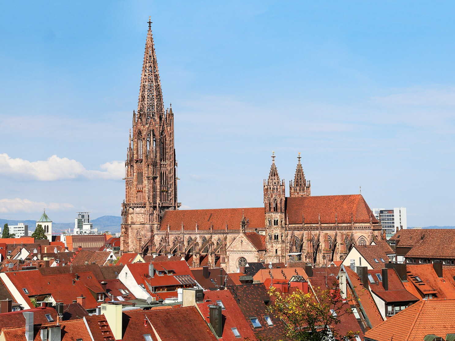 A stunning view of the Freiburg Cathedral, showcasing its intricate architecture against the backdrop of Freiburg im Breisgau. A stunning view of the Freiburg Cathedral, showcasing its intricate architecture against the backdrop of Freiburg im Breisgau.