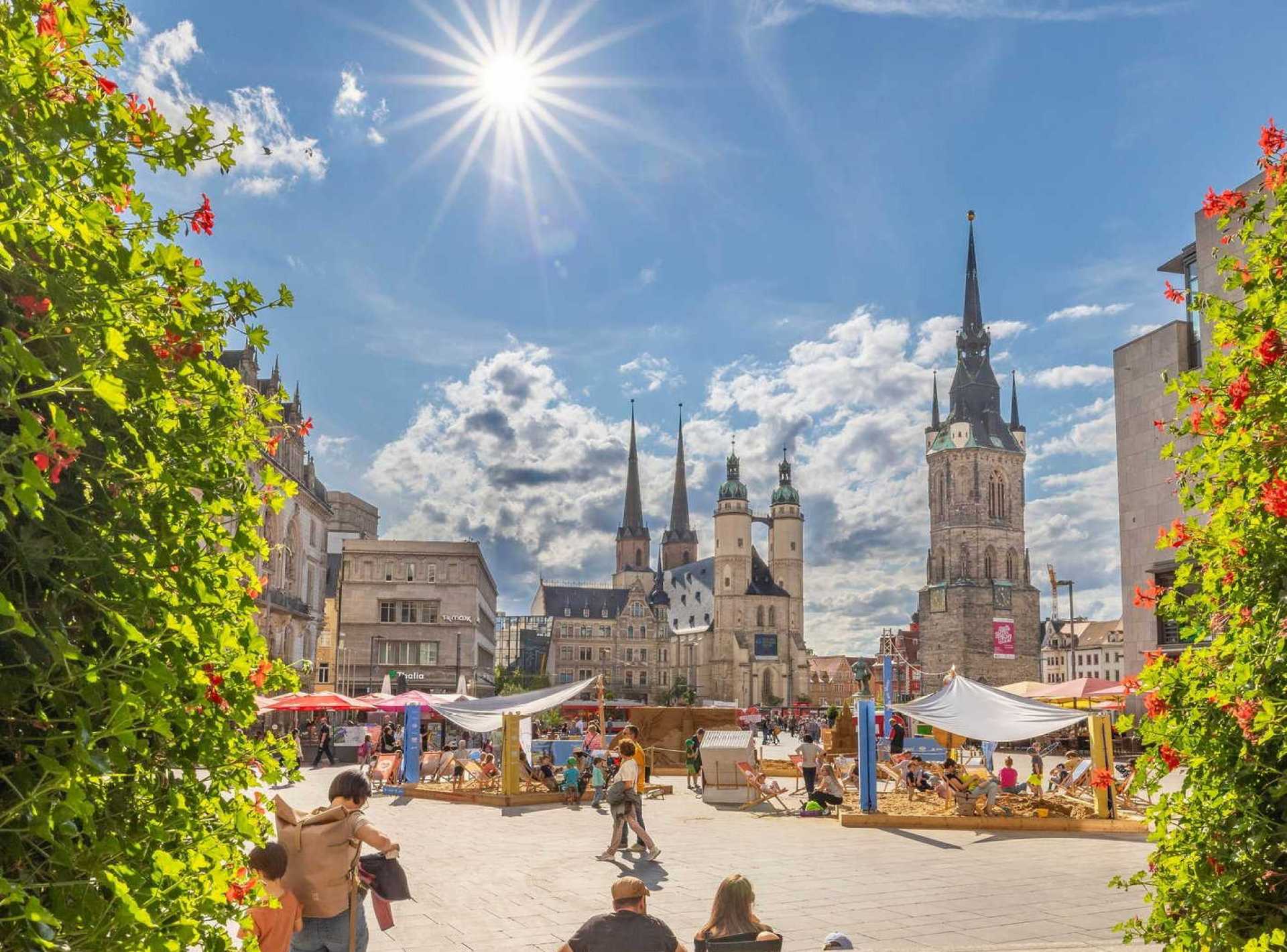 Vibrant market square in Halle showcasing local shops and visitors enjoying the bustling atmosphere. Vibrant market square in Halle showcasing local shops and visitors enjoying the bustling atmosphere.