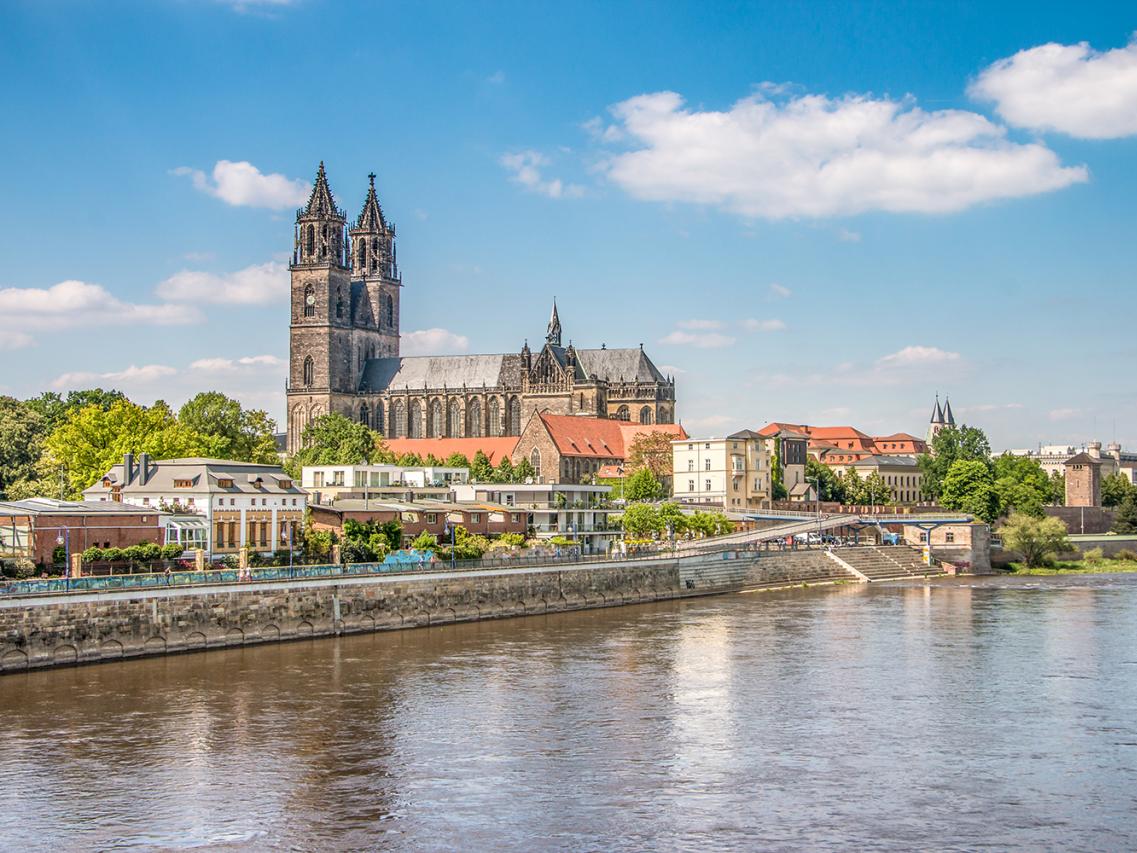 Alt text: Stunning view of Magdeburg Cathedral, showcasing its impressive Gothic architecture against a clear blue sky. Alt text: Stunning view of Magdeburg Cathedral, showcasing its impressive Gothic architecture against a clear blue sky.