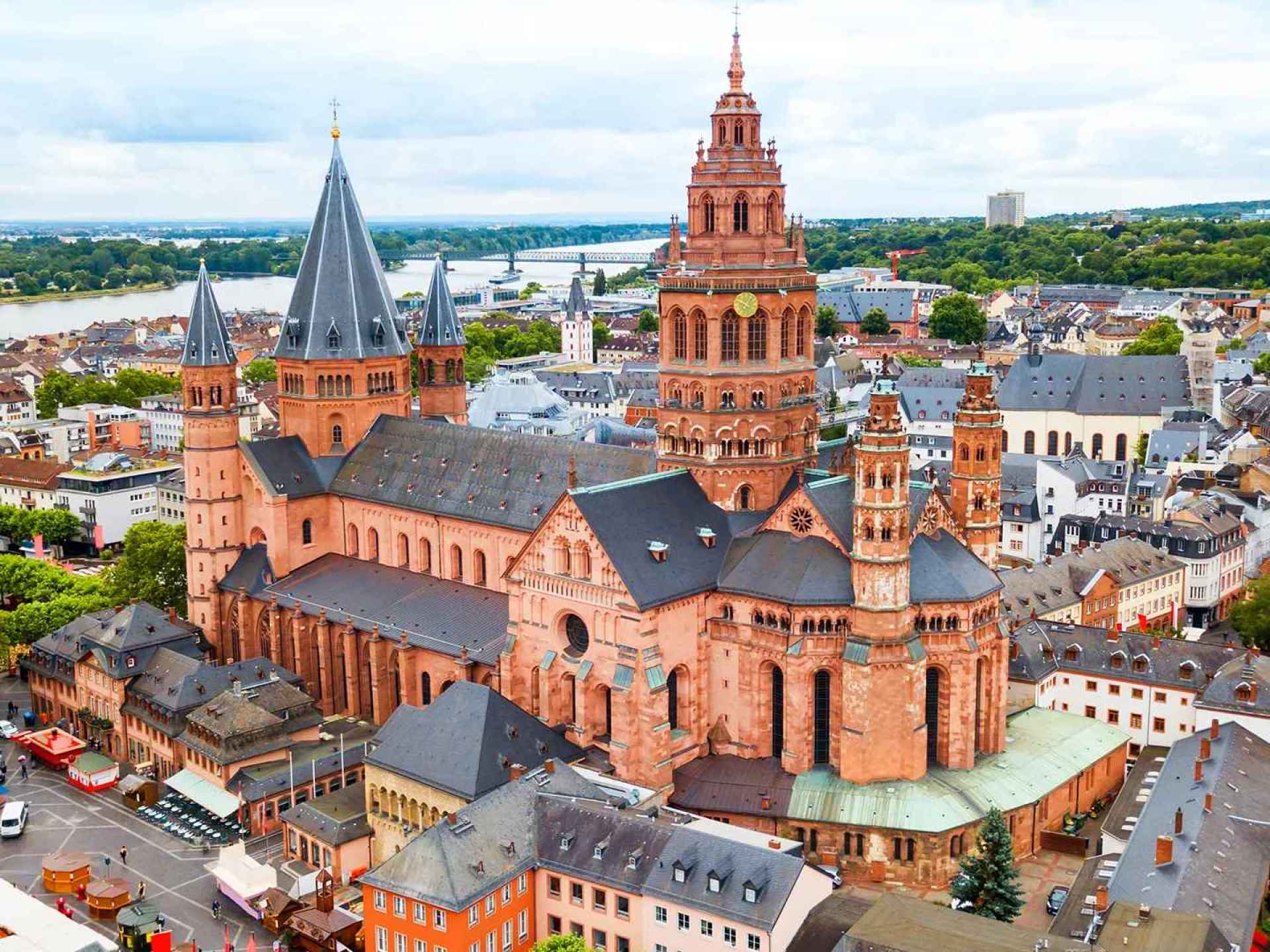 A stunning view of Mainz Cathedral showcasing its impressive architecture against a clear sky. A stunning view of Mainz Cathedral showcasing its impressive architecture against a clear sky.