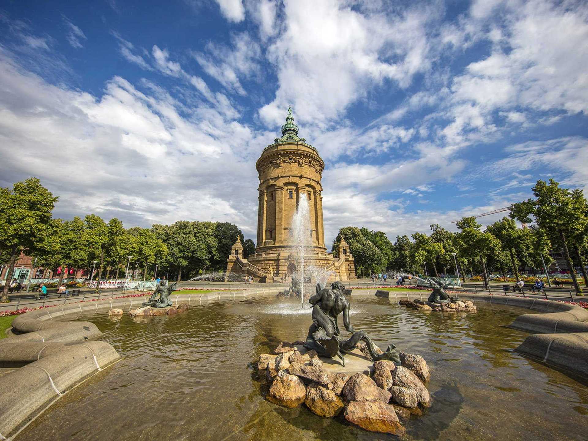Water tower in Mannheim, Germany, showcasing its stunning architecture and vibrant surroundings with lush greenery. Water tower in Mannheim, Germany, showcasing its stunning architecture and vibrant surroundings with lush greenery.