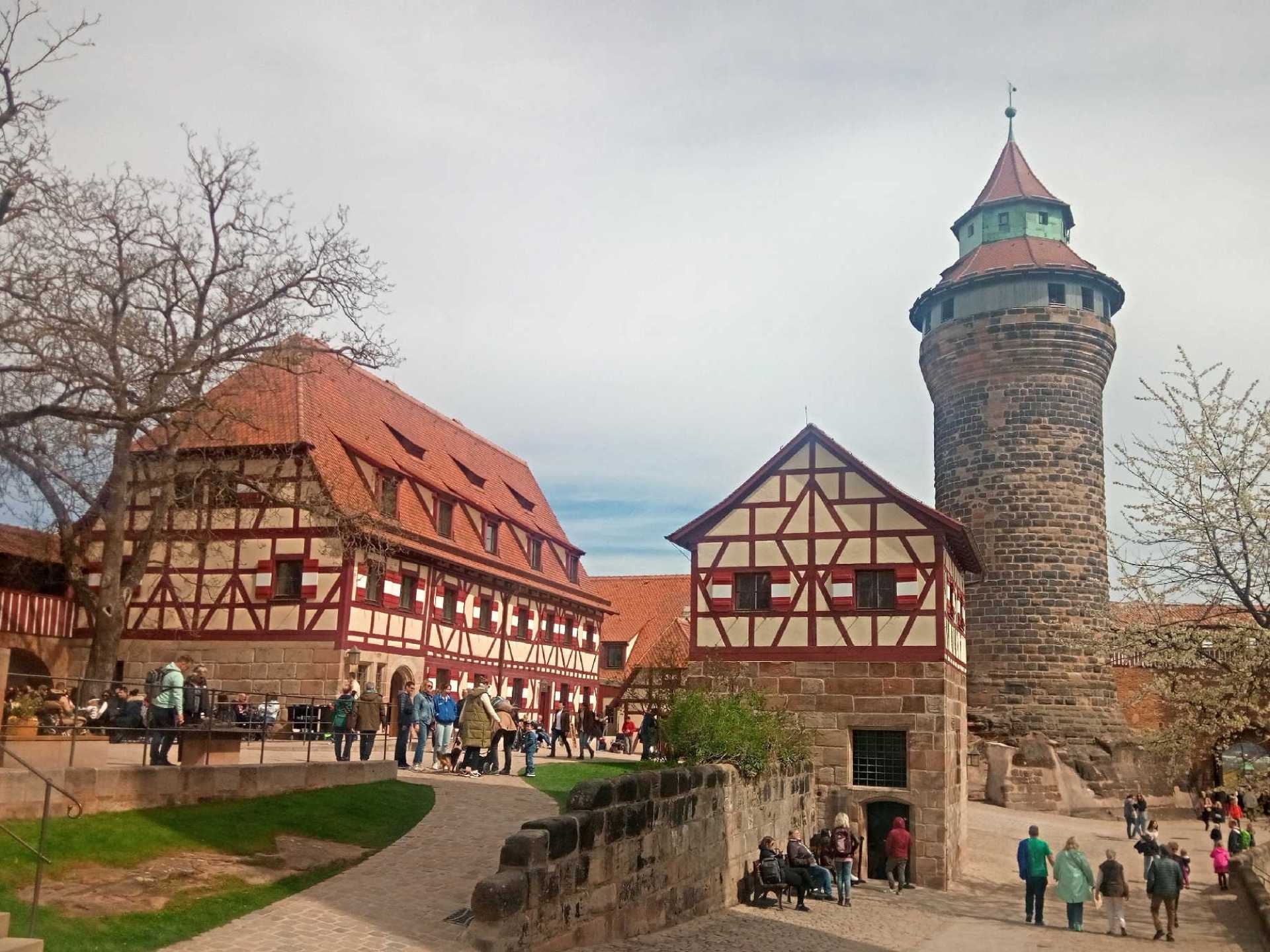 Alt text: A scenic view of Nuremberg Castle highlighting its historic architecture and stunning surroundings in Nuremberg, Germany. Alt text: A scenic view of Nuremberg Castle highlighting its historic architecture and stunning surroundings in Nuremberg, Germany.