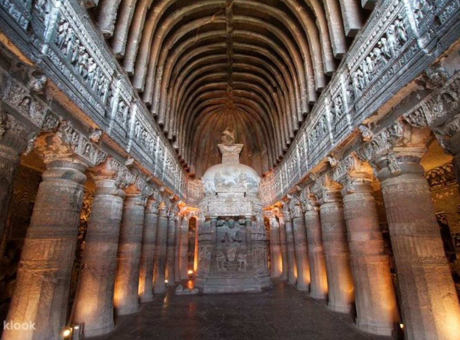 Stunning view of the Ajanta Caves in Aurangabad, showcasing intricate ancient rock-cut architecture and lush surroundings. Stunning view of the Ajanta Caves in Aurangabad, showcasing intricate ancient rock-cut architecture and lush surroundings.