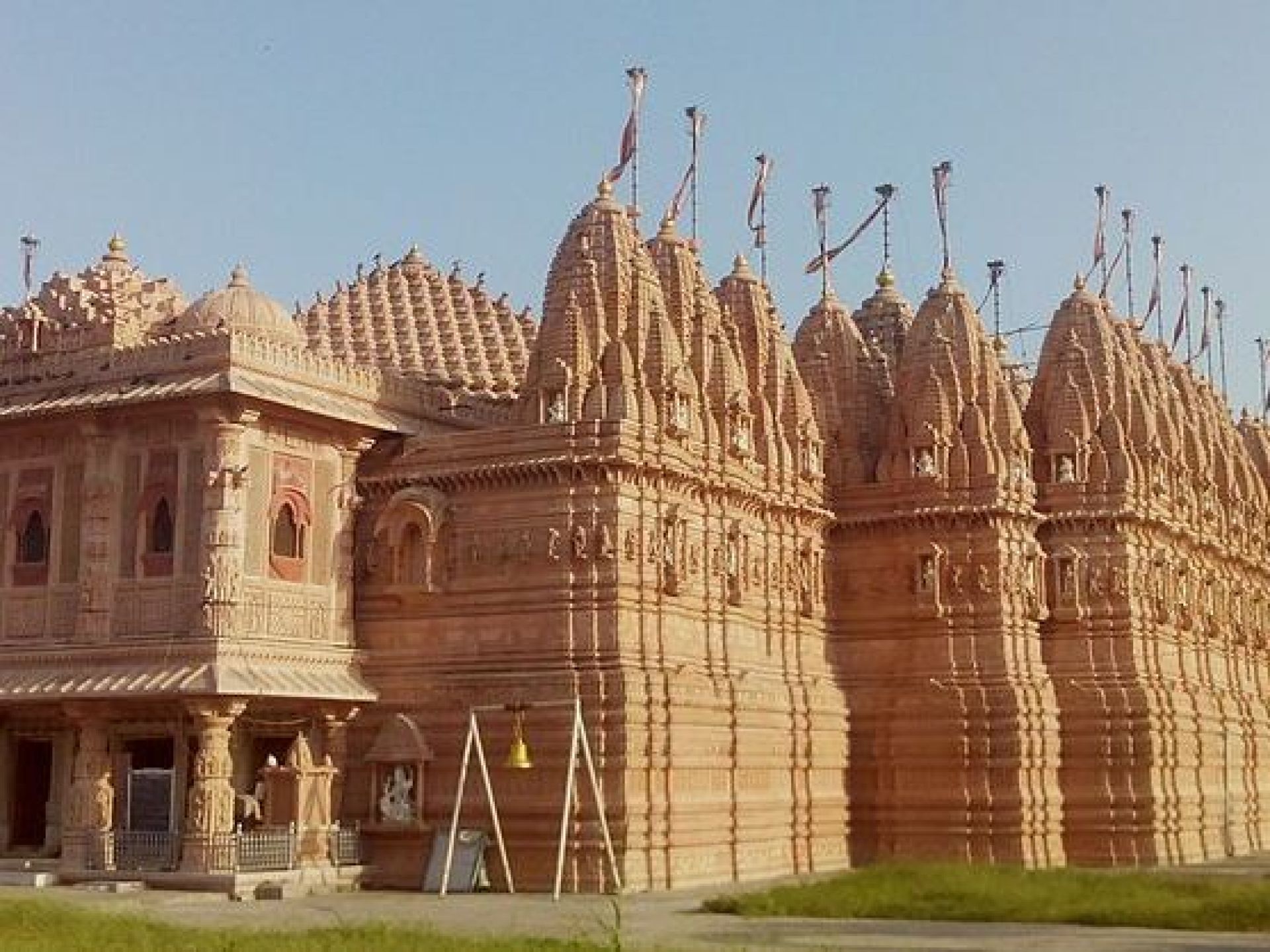 A stunning view of the Bhadreshwar Jain Temple showcasing its intricate architecture and serene surroundings in Bhadreswar. A stunning view of the Bhadreshwar Jain Temple showcasing its intricate architecture and serene surroundings in Bhadreswar.