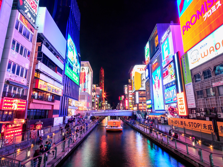 Night view of the vibrant Dotonbori Canal in Osaka, showcasing colorful lights and bustling nightlife. Night view of the vibrant Dotonbori Canal in Osaka, showcasing colorful lights and bustling nightlife.
