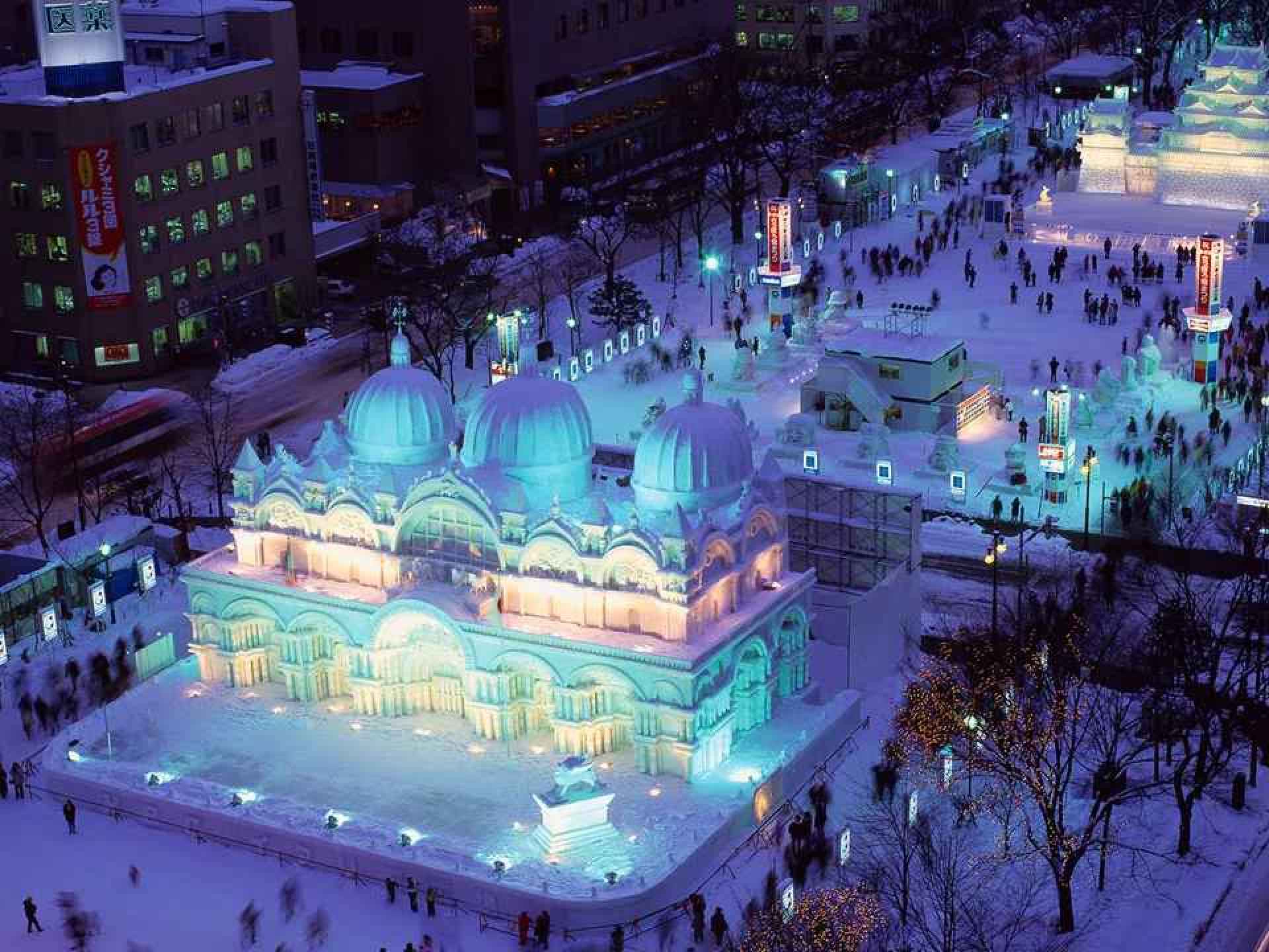 A vibrant scene from the Sapporo Snow Festival showcasing elaborate snow sculptures and visitors enjoying the winter festivities. A vibrant scene from the Sapporo Snow Festival showcasing elaborate snow sculptures and visitors enjoying the winter festivities.