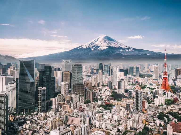 Stunning skyline view of Tokyo showcasing iconic skyscrapers under a clear blue sky. Stunning skyline view of Tokyo showcasing iconic skyscrapers under a clear blue sky.