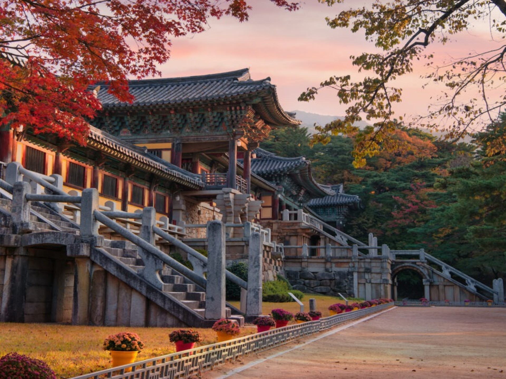 A serene view of the Bulguksa Buddhist Temple in Gyeongju, showcasing its intricate architecture and tranquil surroundings. A serene view of the Bulguksa Buddhist Temple in Gyeongju, showcasing its intricate architecture and tranquil surroundings.