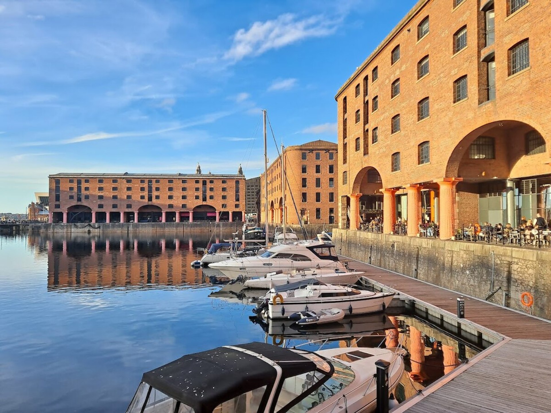 A scenic view of Liverpool’s Royal Albert Dock showcasing historic architecture and vibrant waterfront activities. A scenic view of Liverpool’s Royal Albert Dock showcasing historic architecture and vibrant waterfront activities.