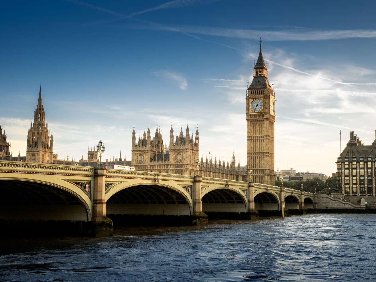 A view of Big Ben and the Houses of Parliament in London, showcasing the iconic British architecture against a clear sky. A view of Big Ben and the Houses of Parliament in London, showcasing the iconic British architecture against a clear sky.