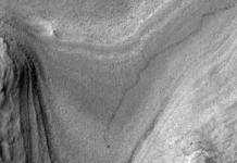 NASA’s Mars orbiter snapped this image of Curiosity trucking along down at the surface