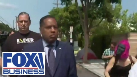 Woman in gorilla mask in LA attacks Larry Elder on street Woman in gorilla mask in LA attacks Larry Elder on street