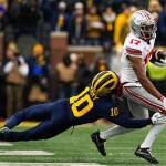 Michigan players circle up to defend block ‘M’ after Ohio State loss Michigan players circle up to defend block ‘M’ after Ohio State loss