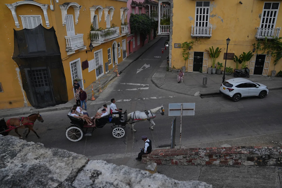 A Colombian city swaps iconic horse buggies for electric carriages amid animal welfare concerns A Colombian city swaps iconic horse buggies for electric carriages amid animal welfare concerns