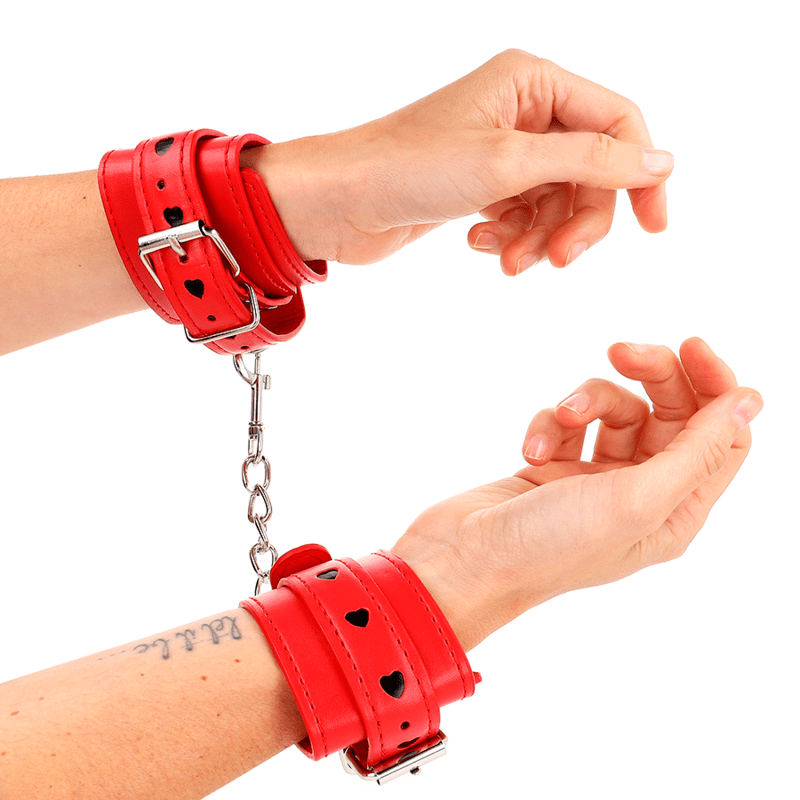 KINK – APPAREILS-POIGNETS ROUGES AVEC INCRUSTATION COEUR NOIR RÉGLABLE 21-28 CM X 5,5 CM
