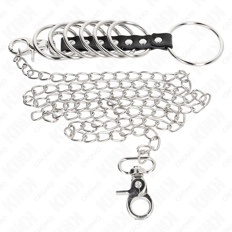 KINK – 7 ANNEAUX PÉNIS EN MÉTAL DE 3,8 CM À 5 CM CONNECTÉS AVEC DU CUIR ET UNE CHAÎNE EN MÉTAL 100 CM