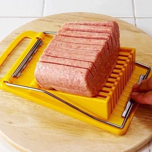 La rebanadora corta la carne del almuerzo, el jamón de huevos cocidos en 11 rebanadas limpias e iguales sin machacar (solo se adapta a queso suave,