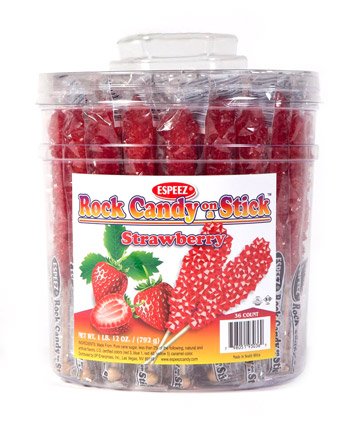 Caramelo de roca roja de fresa en un tarro de palo