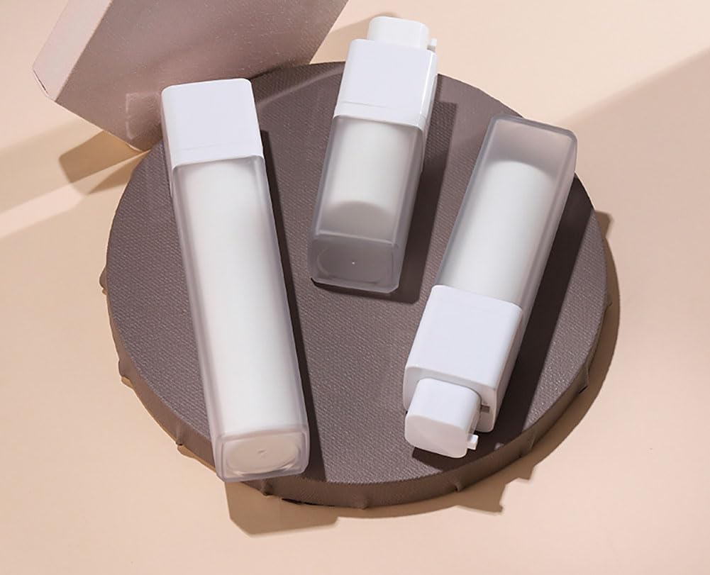Dispensadores de esencia cuadradas, botellas de bomba sin aire esmeriladas, botellas de bomba vacías recargables de plástico para base, crema y