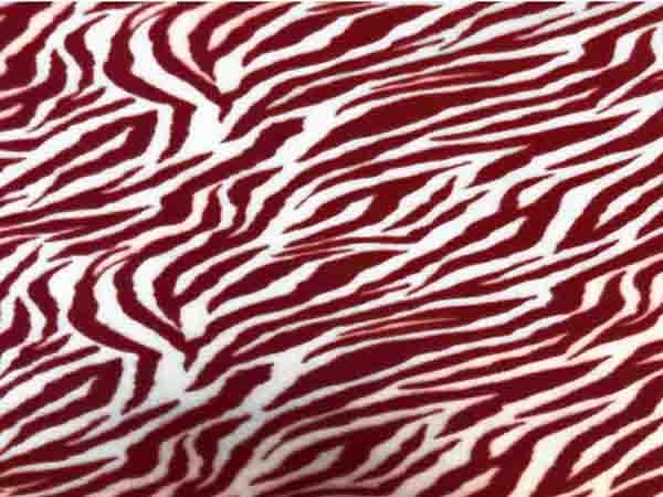 Tela polar con estampado animal rojo blanco cebra tela por The Yard