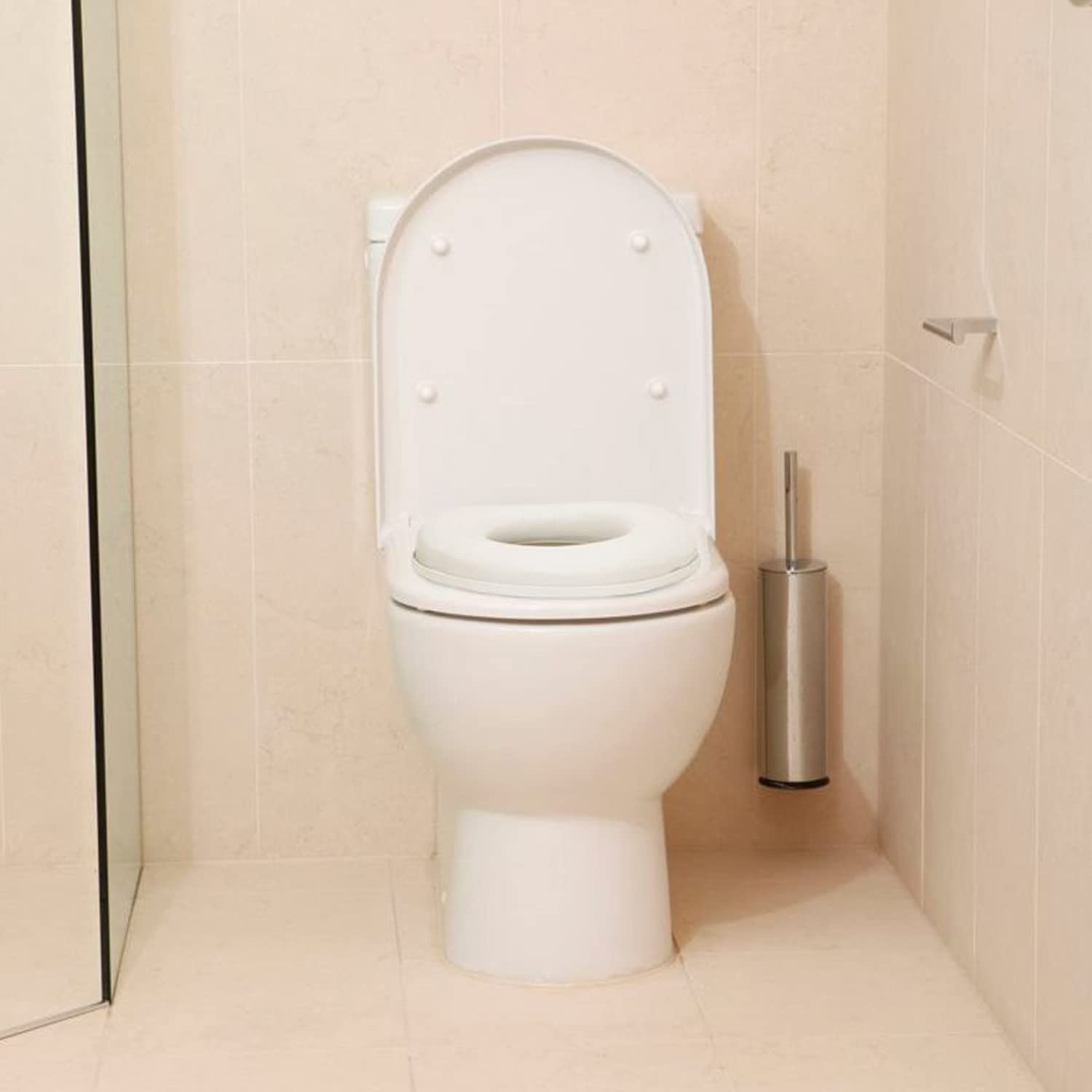 Dreambaby Asiento de orinal suave al tacto, cómodo asiento acolchado, con base alta debajo para un posicionamiento seguro, se adapta a la mayoría de