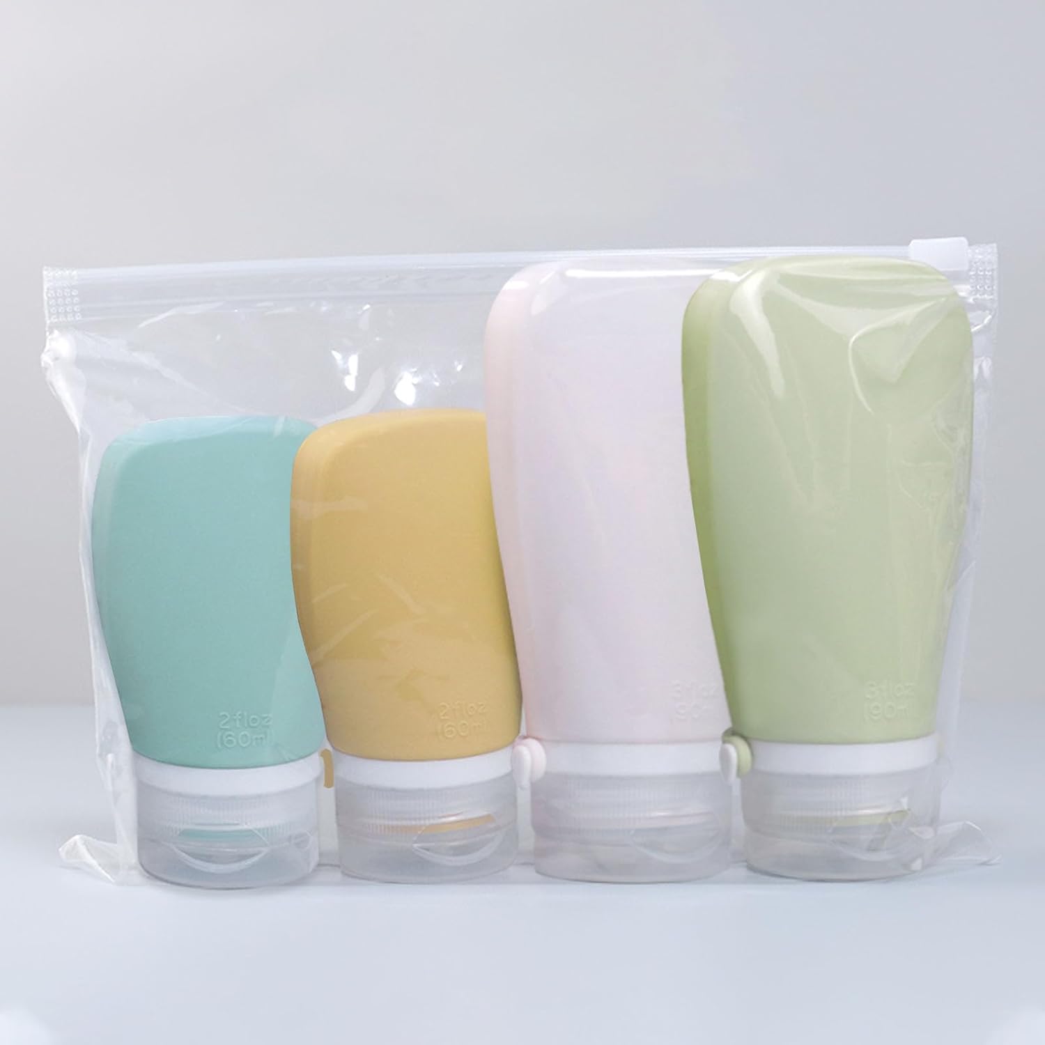 Paquete de 4 botellas de viaje para artículos de tocador, recipientes de tamaño de viaje aprobados por la TSA, botellas de viaje de silicona a