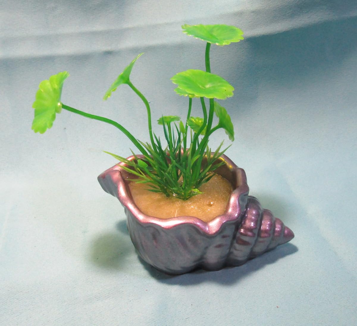 Aquarium Decoration – Mauve and silver shell with green artificial plant. Unique, heavy,and durable solid fish tank ornament. Made in the USA.