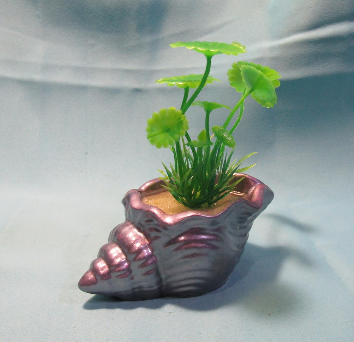 Aquarium Decoration – Mauve and silver shell with green artificial plant. Unique, heavy,and durable solid fish tank ornament. Made in the USA.
