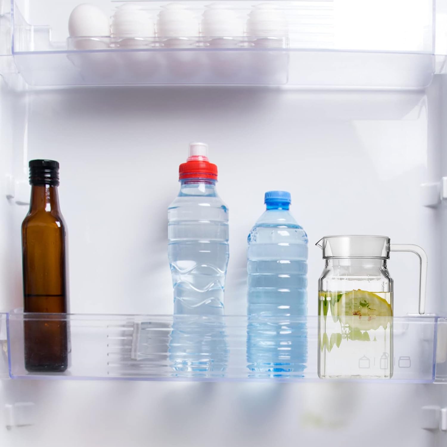 Garneck Botella de agua de refrigeración transparente, jarra de jugo de leche, jarra de agua de plástico con tapa y boquilla, 2 unidades
