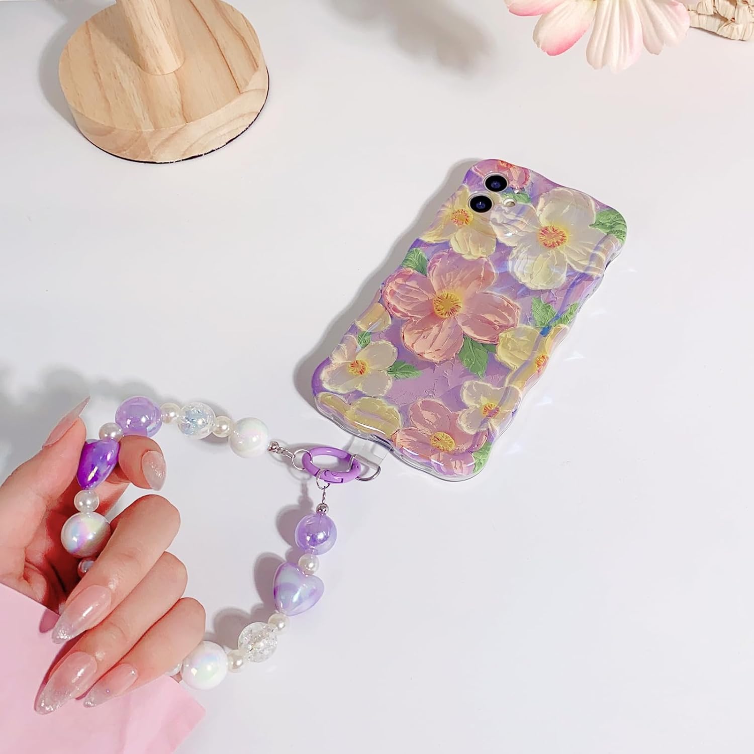 NITITOP Funda compatible con iPhone 11, bonita funda de pulsera de flores de aceite moradas con bonita correa de muñeca con cordón de flores para