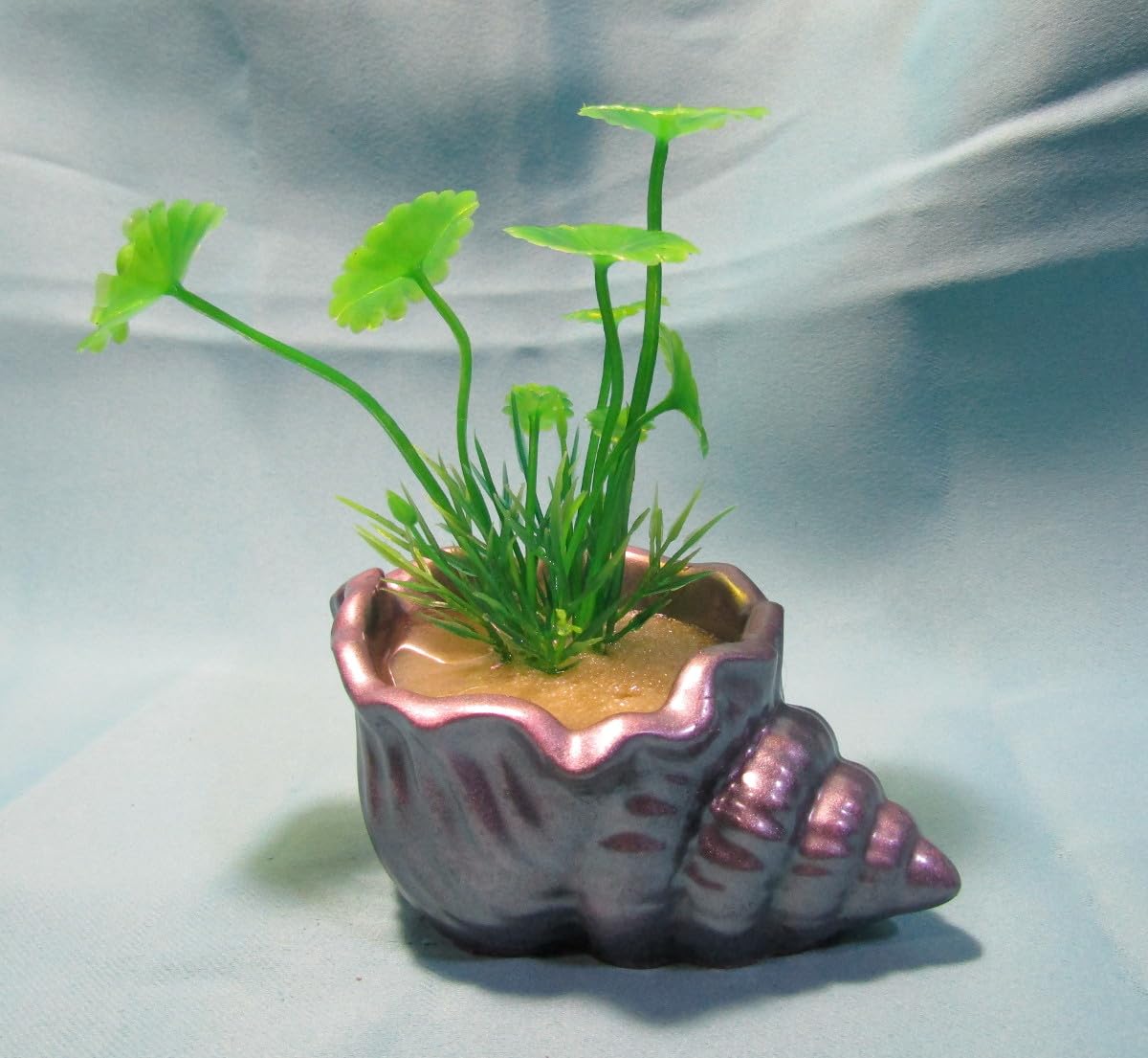Aquarium Decoration – Mauve and silver shell with green artificial plant. Unique, heavy,and durable solid fish tank ornament. Made in the USA.