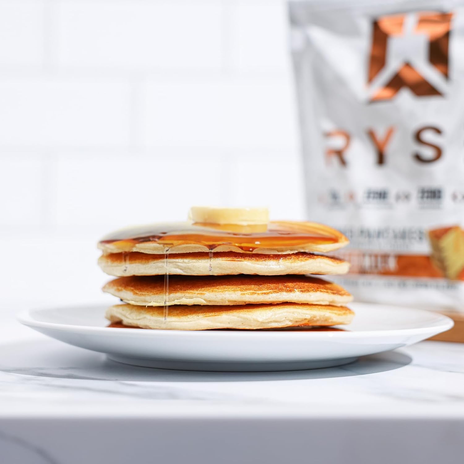 RYSE – Panqueques de proteína cargados  Mezcla de proteínas naturalmente endulzadas para panqueques  cero azúcares añadidos  0.78 onzas de proteína