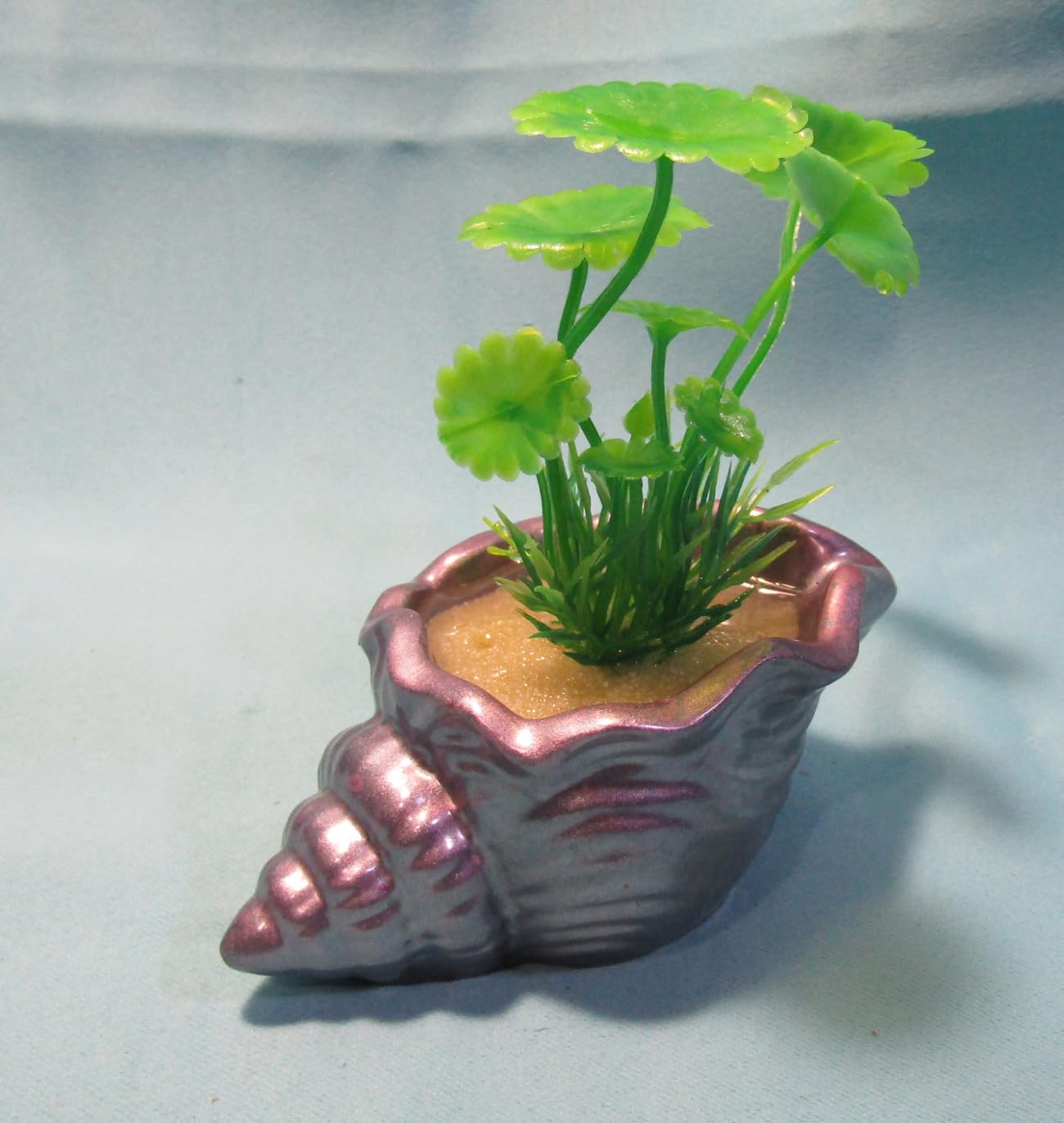 Aquarium Decoration – Mauve and silver shell with green artificial plant. Unique, heavy,and durable solid fish tank ornament. Made in the USA.