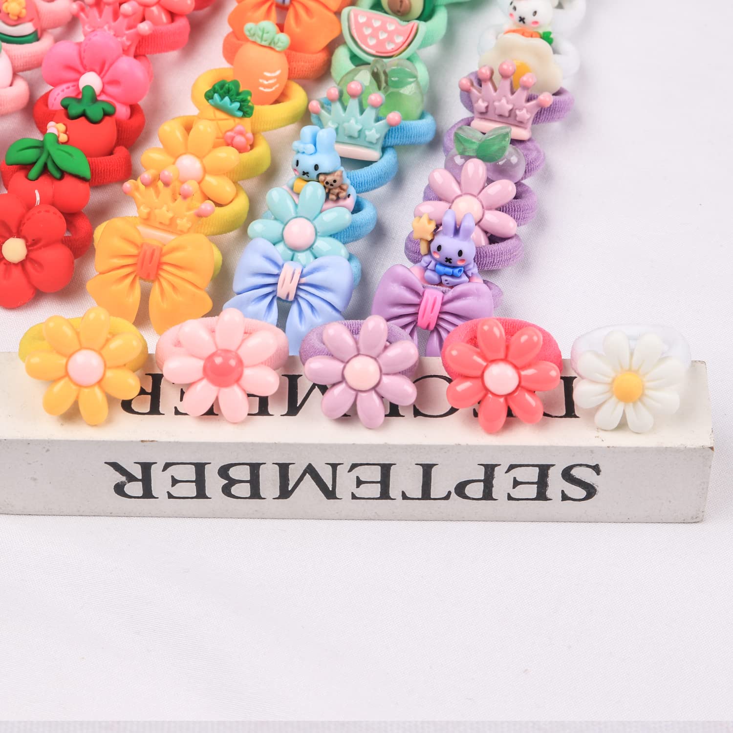 Ouchless – 80 bandas para el pelo de bebé, lazos de resina dulce de 1 pulgada, mini bandas elásticas de goma de colores mezclados al azar