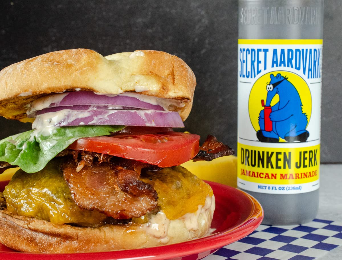 Secret Aardvark Drunken Jerk – Salsa picante jamaicana Jerk y marinada, hecha con condimento jamaicano Jerk, salsa de soja y pimientos habaneros,