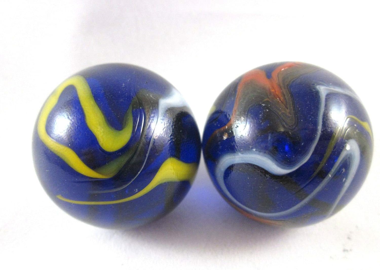 Juego de 2 canicas de cristal macizo de 1.378 in de Michelangelo en forma de remolino grande, color negro, azul, rojo, amarillo, blanco