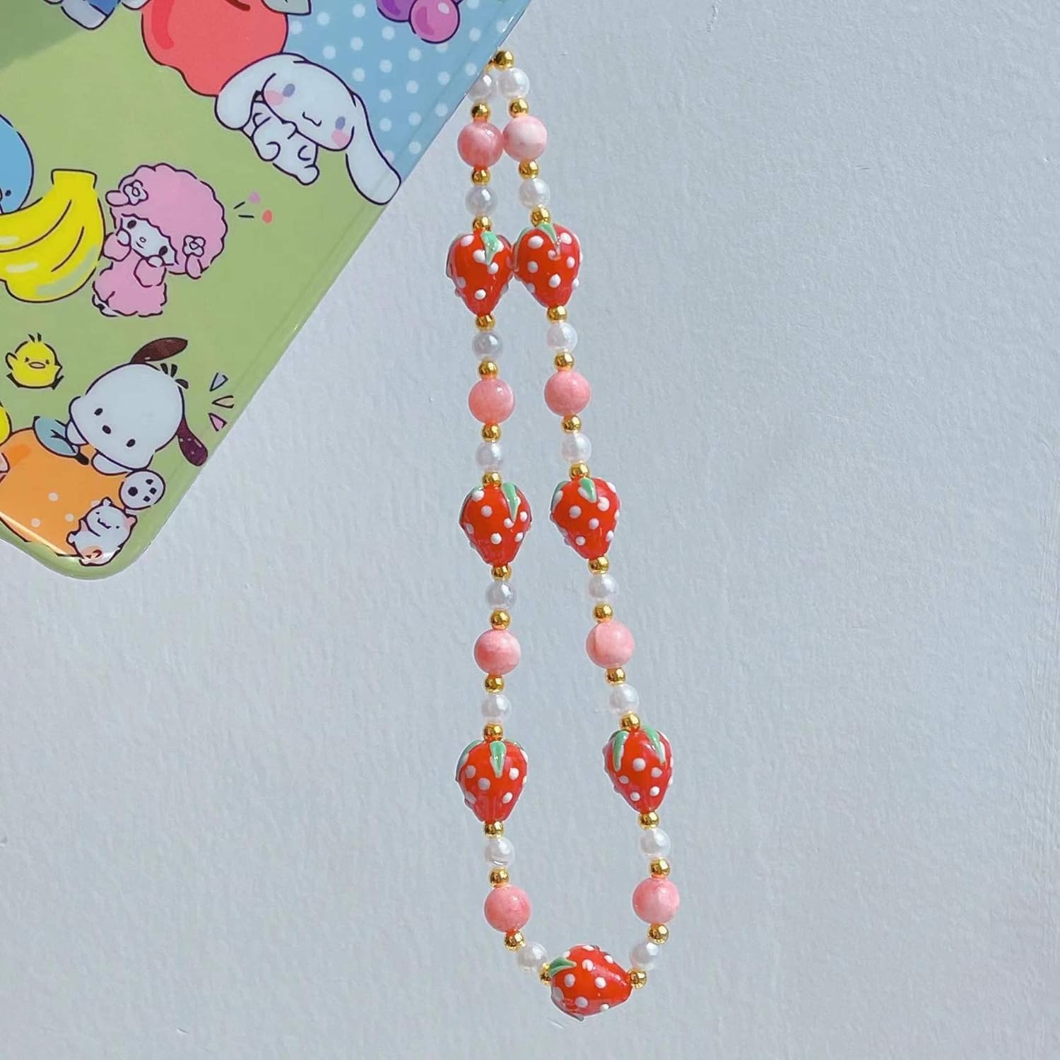 Meefisher 2 piezas de fresa con cuentas para teléfono, cordón de perlas de fruta dulce, correa de muñeca hecha a mano, cuentas antipérdidas,