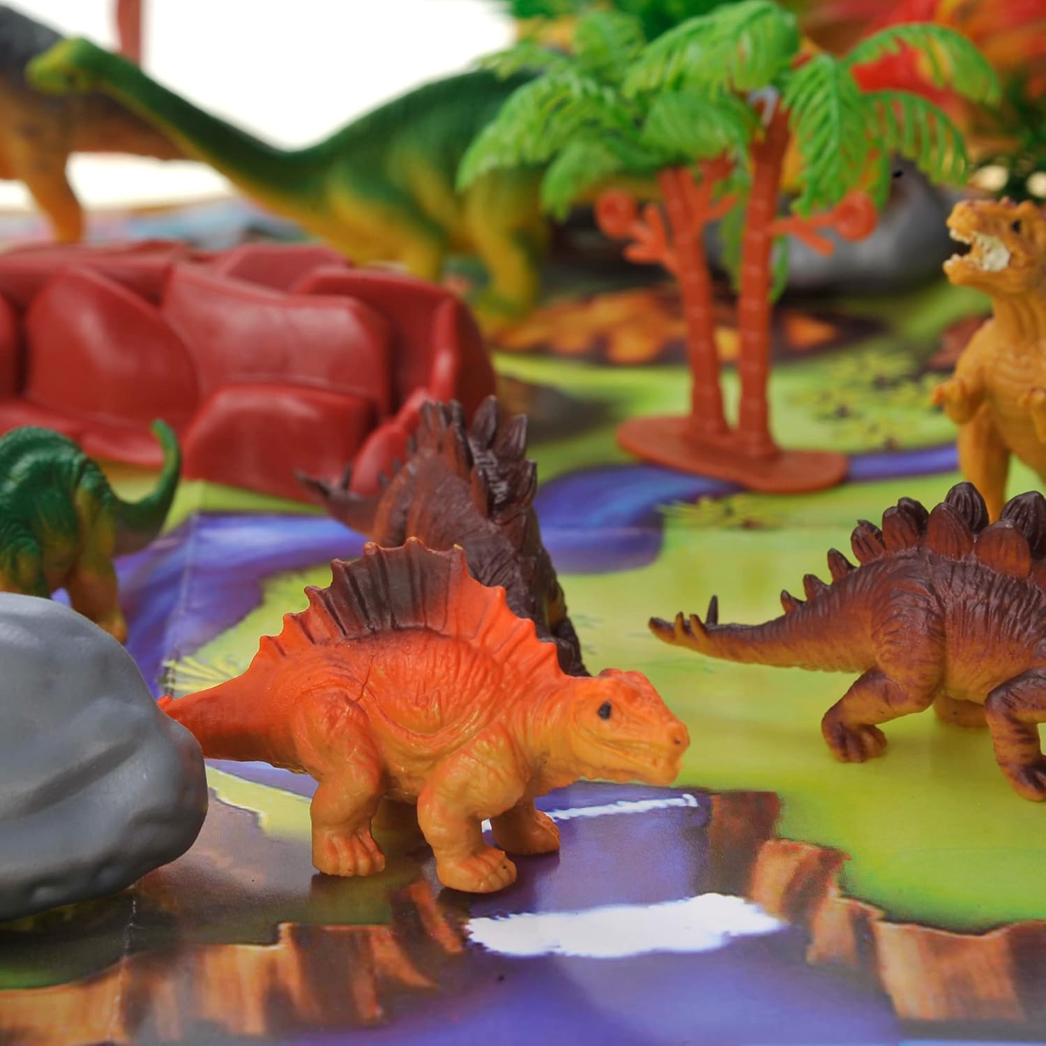 PowerTRC Juego de figuras de dinosaurio con árboles, rocas, tapete de juego y contenedor para niños y niñas  Crea un parque de dinosaurios con un