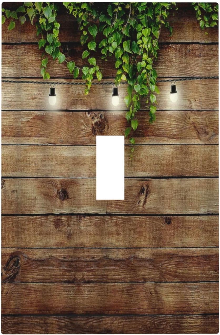 Tablero de madera vintage rústico con hojas verdes, cubierta de interruptor de luz de palanca individual, tablones de madera de granja, puerta de