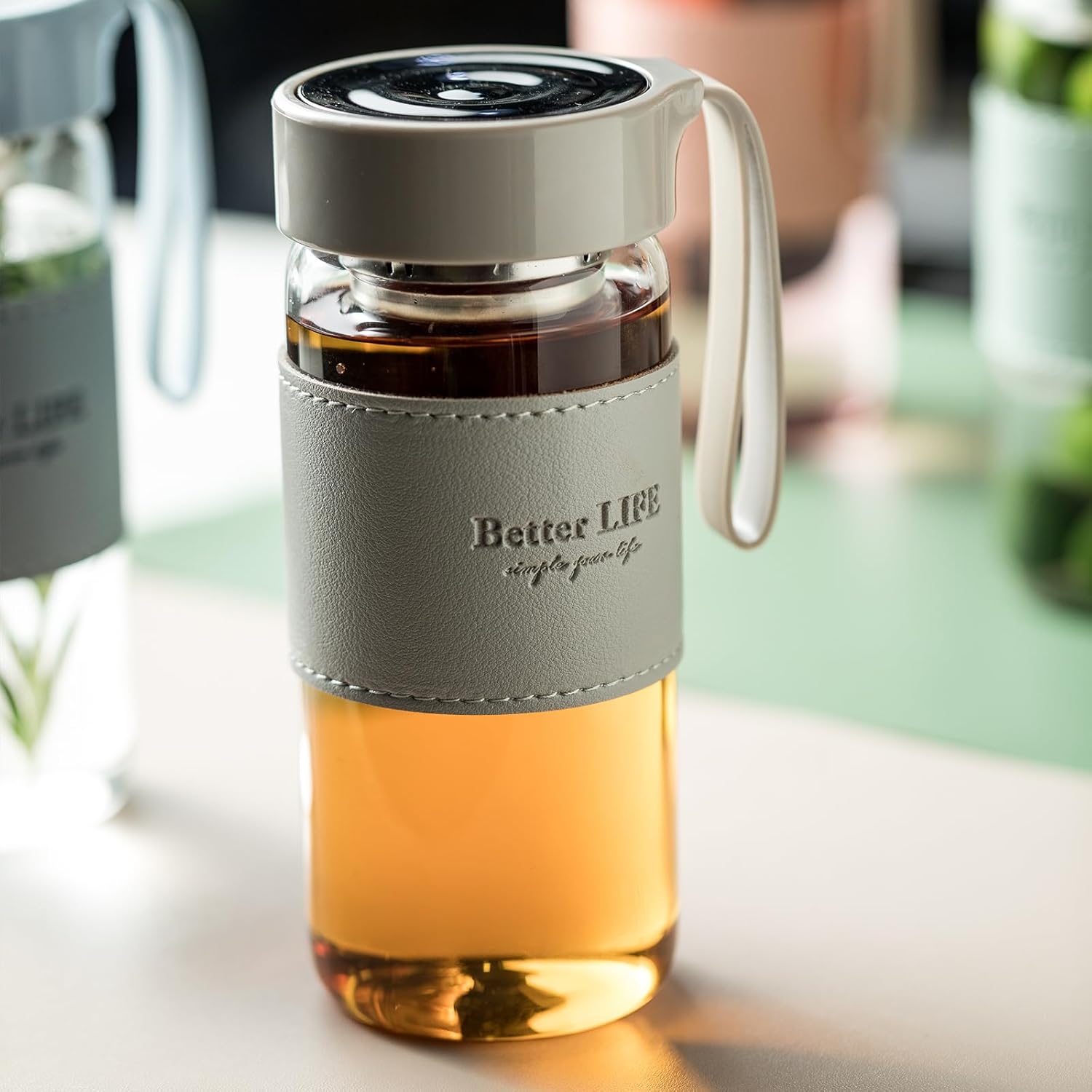 Botella de té de vidrio de 16 onzas con funda antideslizante e infusor de té inoxidable, tapa a prueba de fugas, botella de agua de vidrio portátil