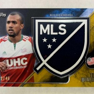 2015 Topps APEX MLS Crest Jumbo Relics Gold #CJR-TB Teal Bunbury JerseyRelic New England Revolution Official Major League Soccer Card in Raw (NM or 2015 Topps APEX MLS Crest Jumbo Relics Gold #CJR-TB Teal Bunbury JerseyRelic New England Revolution Official Major League Soccer Card in Raw (NM or