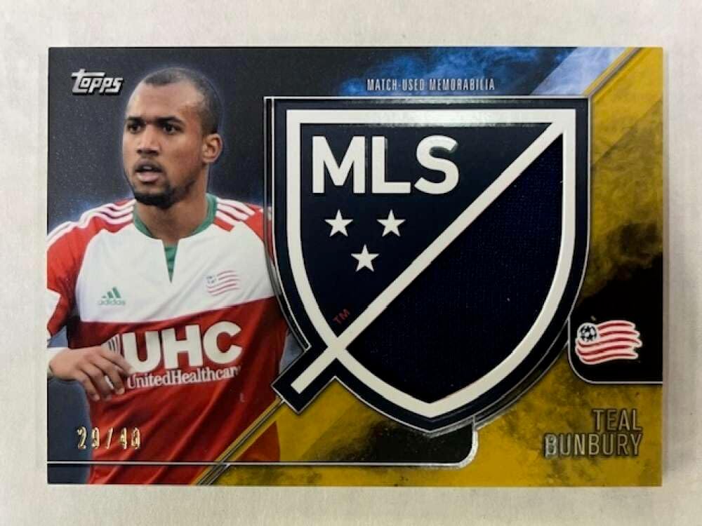 2015 Topps APEX MLS Crest Jumbo Relics Gold #CJR-TB Teal Bunbury JerseyRelic New England Revolution Official Major League Soccer Card in Raw (NM or